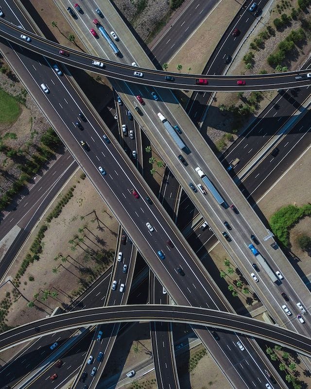 aerial photo of traffic moving on intersecting highways